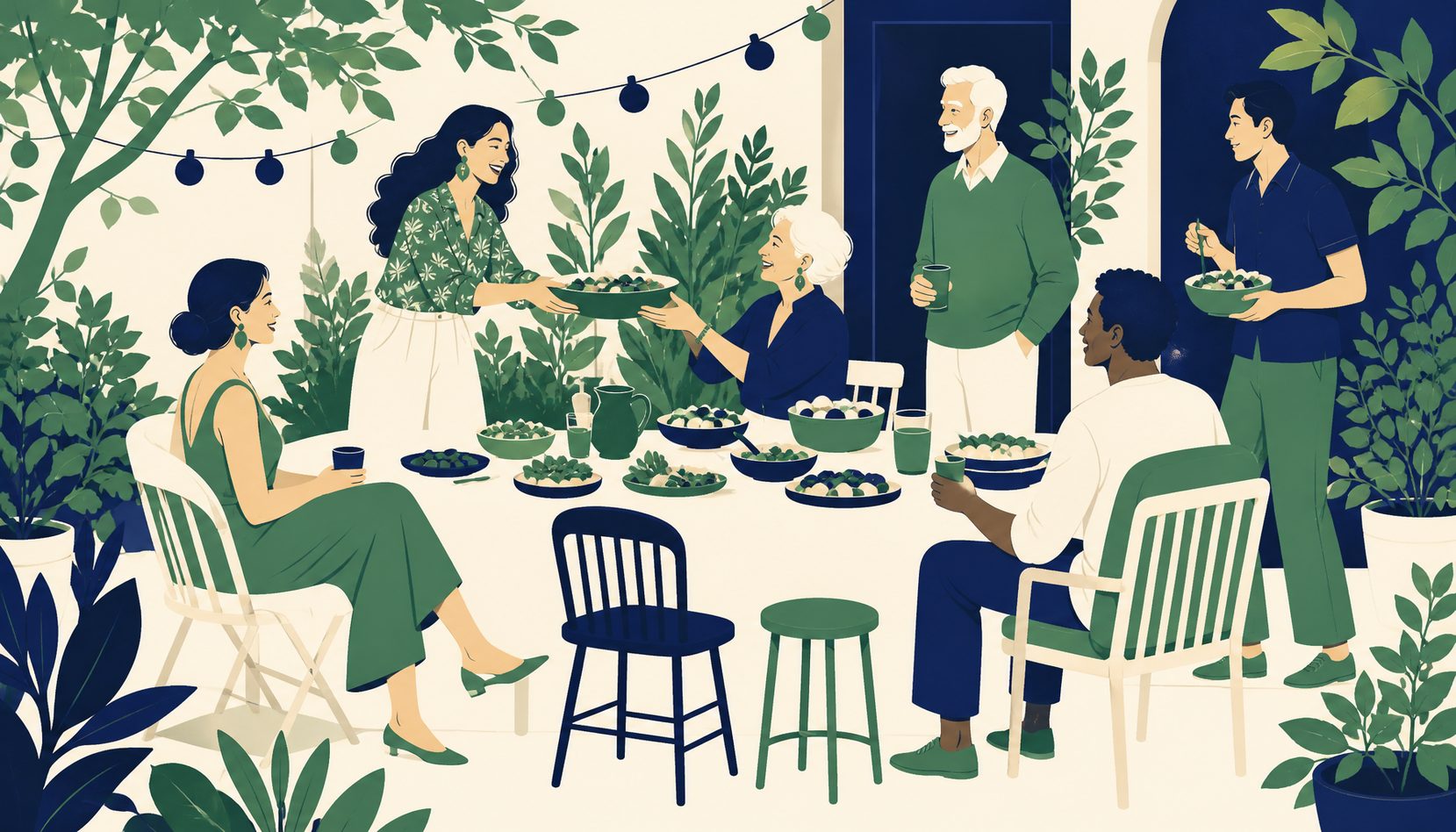 A mixed group of friends spanning several generations gathered around a table full of potluck dishes, one person passing a serving bowl to another mid-laugh